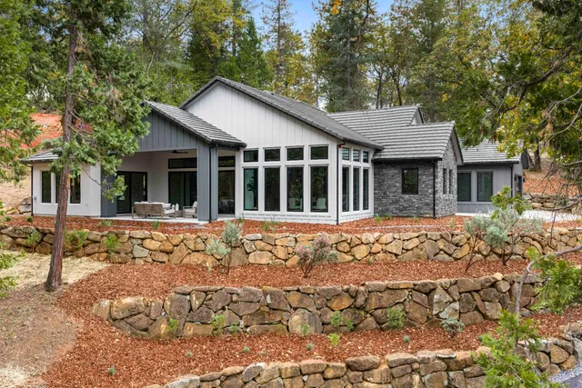 a view of house with yard