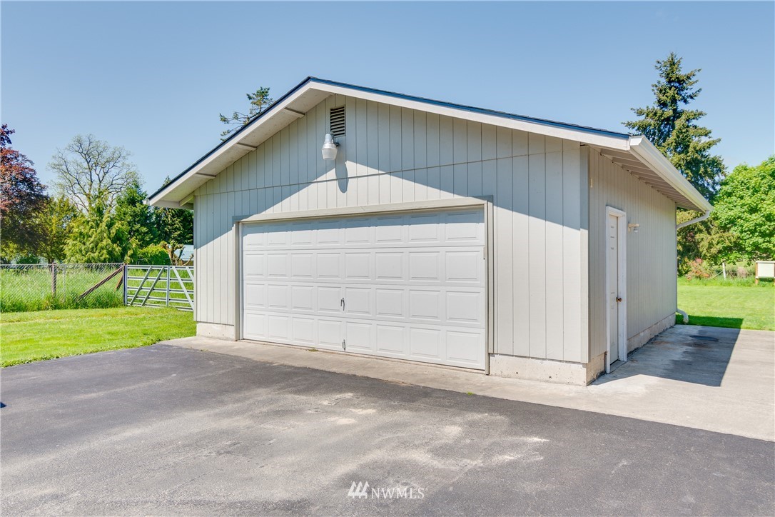 5509 Mt Solo Road Longview, WA 98632 - Photo 16 of 22 a front view of a house with a yard and garage