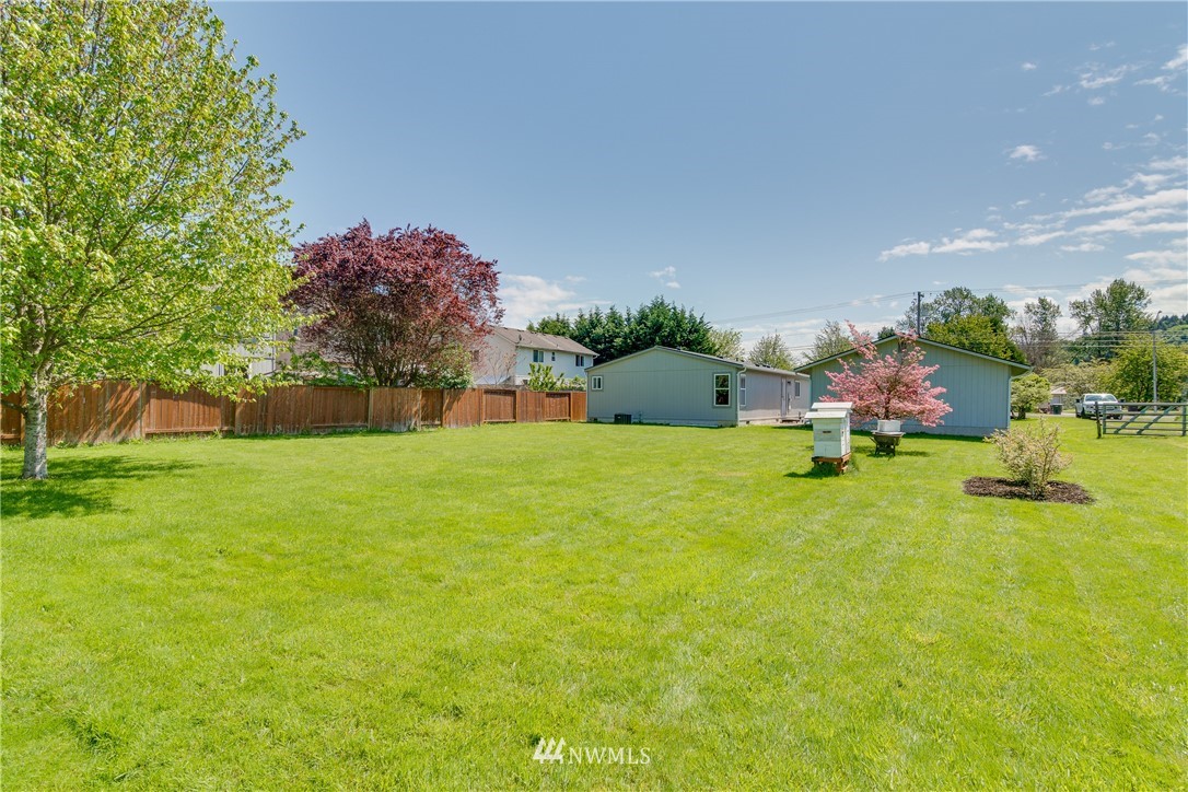 5509 Mt Solo Road Longview, WA 98632 - Photo 18 of 22 a front view of house with yard and trees in the background