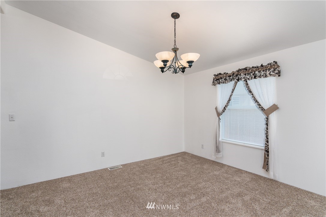 5509 Mt Solo Road Longview, WA 98632 - Photo 3 of 22 a view of a room with a ceiling fan and window