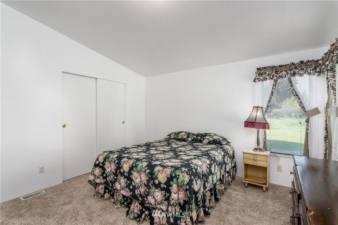 5509 Mt Solo Road Longview, WA 98632 - Photo 9 of 22 a bedroom with a bed and a window