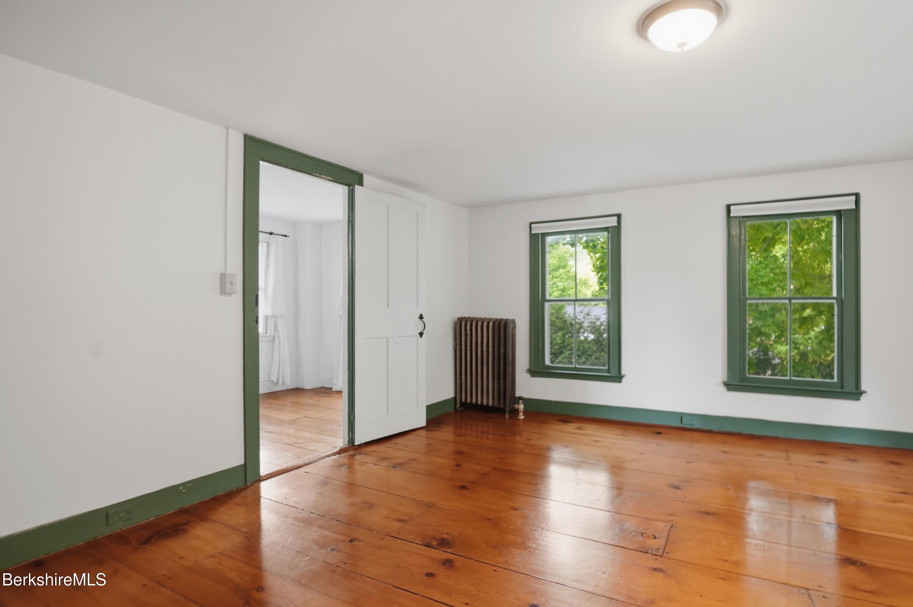 4 Stockbridge Road West Stockbridge, MA 01266 - Photo 56 of 94 a view of an empty room with window and wooden floor