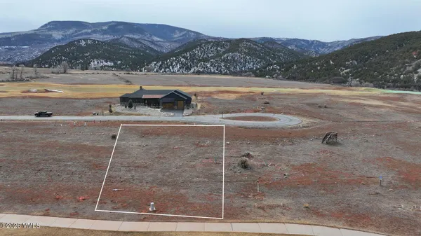 a view of a backyard of a house with a mountain