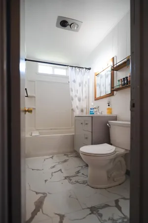 a bathroom with a bathtub and a shower