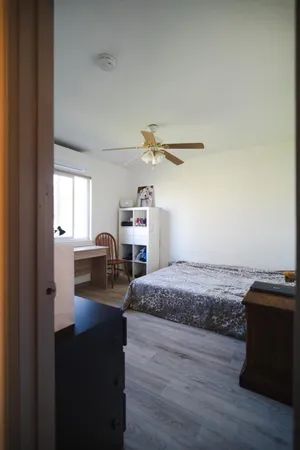 a bed room with a bed and a window