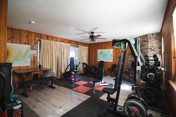 a living room with fireplace furniture and a flat screen tv
