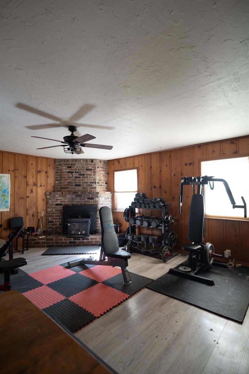 4551 Wheatland Road Wheatland, CA 95692 - Photo 19 of 50 a living room with furniture gym equipment and a fireplace