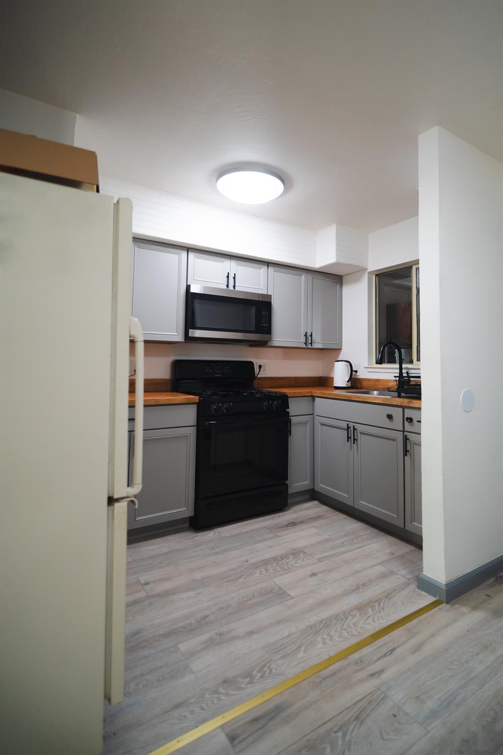 4551 Wheatland Road Wheatland, CA 95692 - Photo 30 of 50 a kitchen with a sink cabinets and stainless steel appliances
