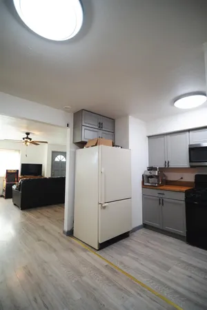 a kitchen with an oven a sink and cabinets