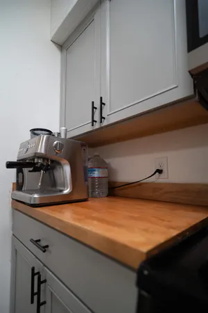 a kitchen with stainless steel appliances granite countertop a sink and cabinets