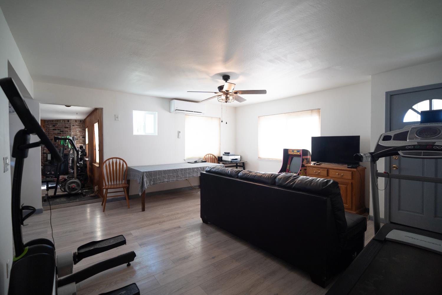 4551 Wheatland Road Wheatland, CA 95692 - Photo 4 of 50 a living room with furniture and a flat screen tv