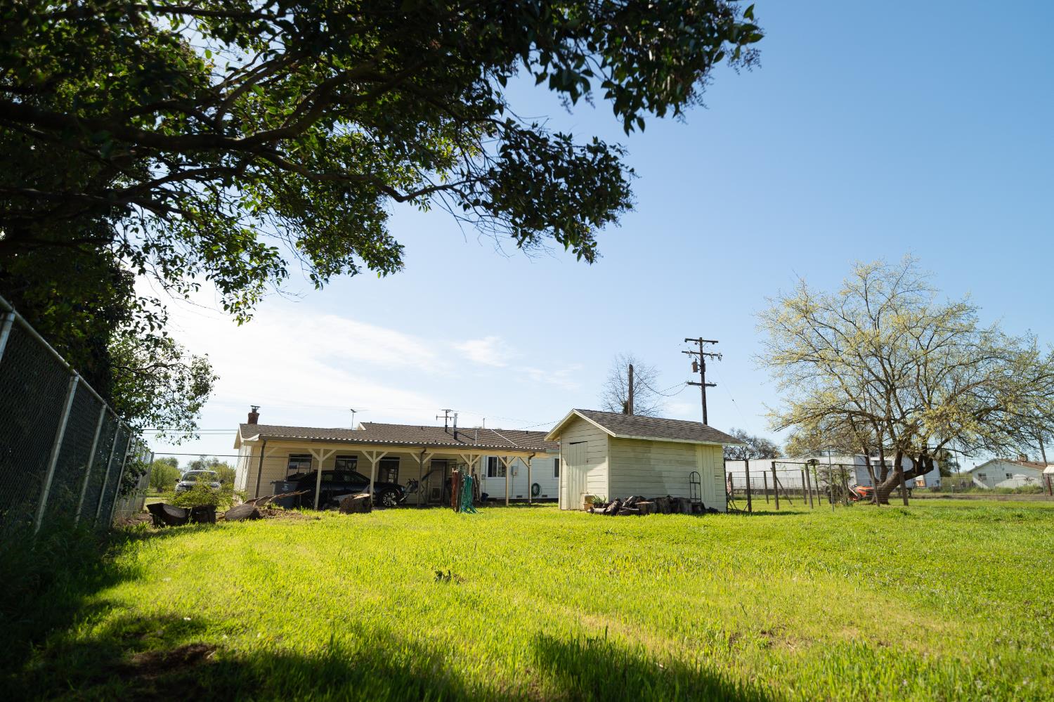4551 Wheatland Road Wheatland, CA 95692 - Photo 41 of 50 a front view of a house with a yard and large trees