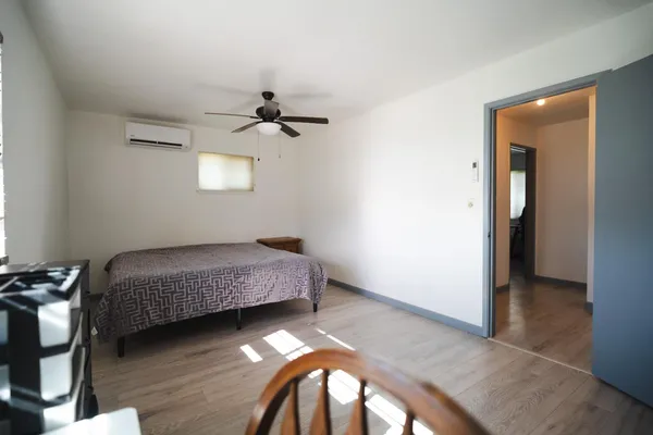 a white toilet sitting next to a bathroom sink and vanity