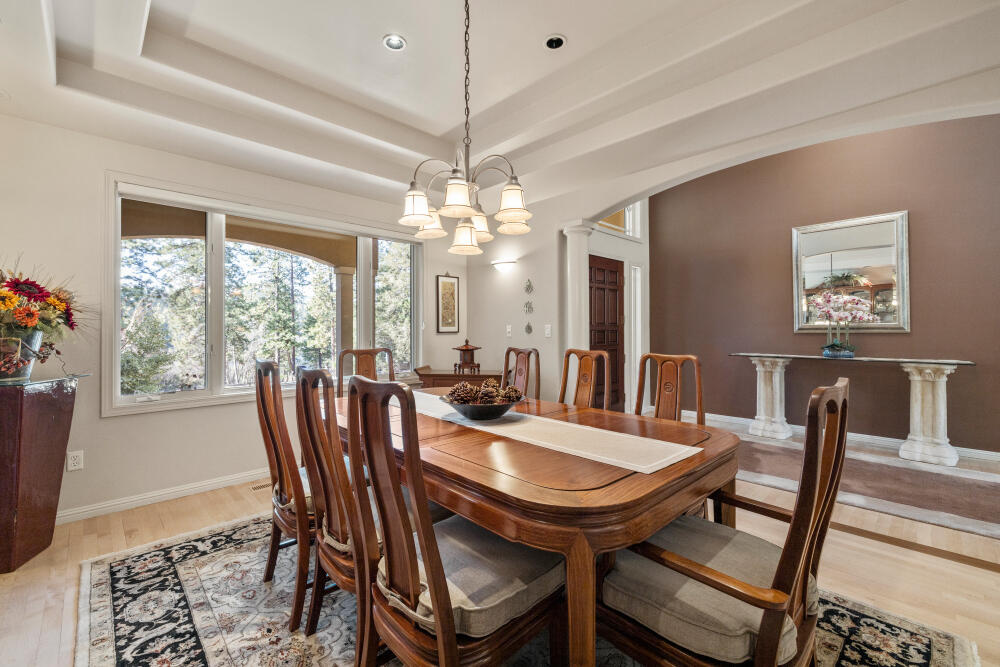11629 Merganser Road Klamath Falls, OR 97601 - Photo 8 of 50 a view of a dining room with furniture window and wooden floor