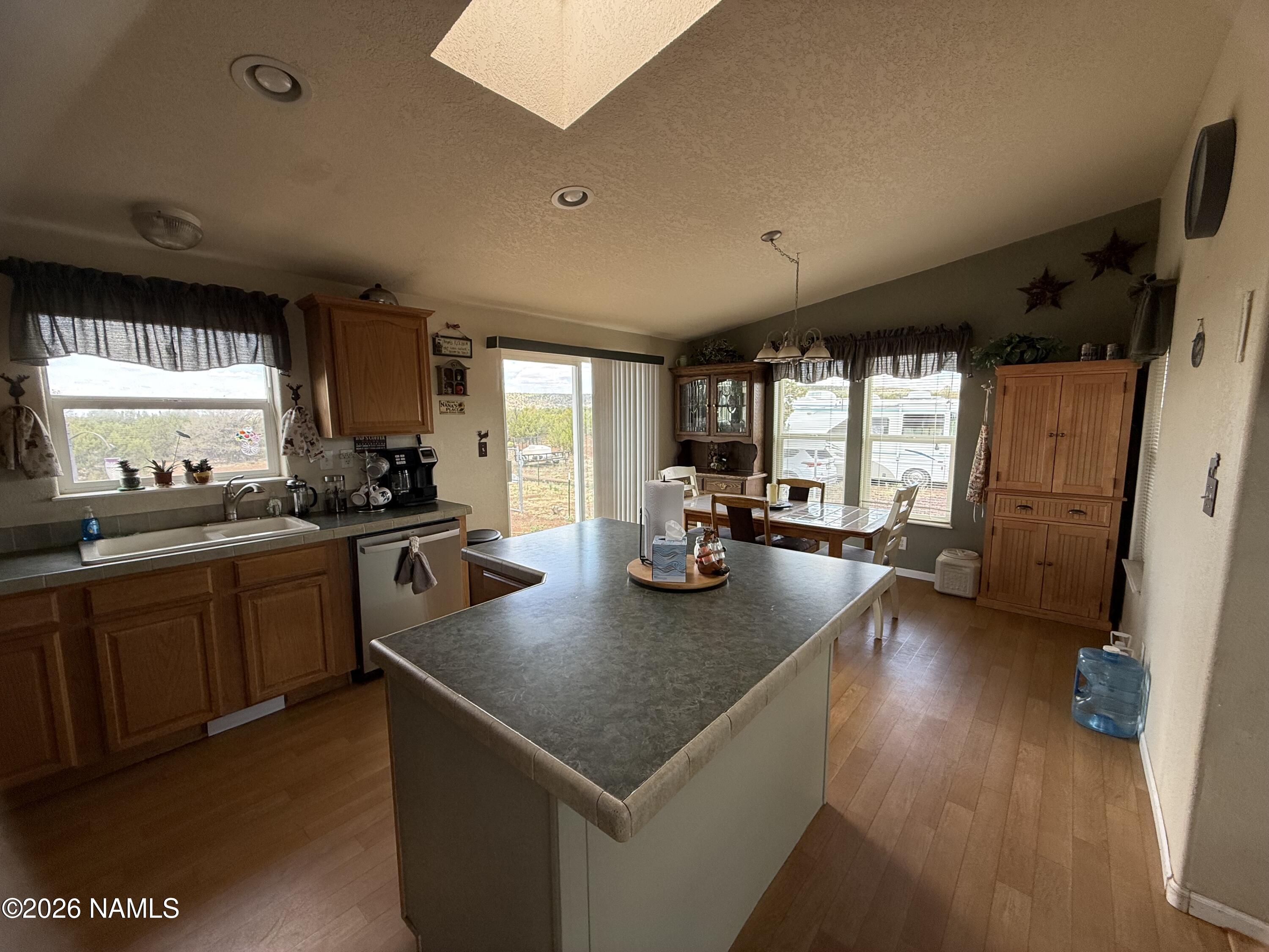 1431 East Cedar Road Williams, AZ 86046 - Photo 17 of 51 a kitchen with sink stove and refrigerator