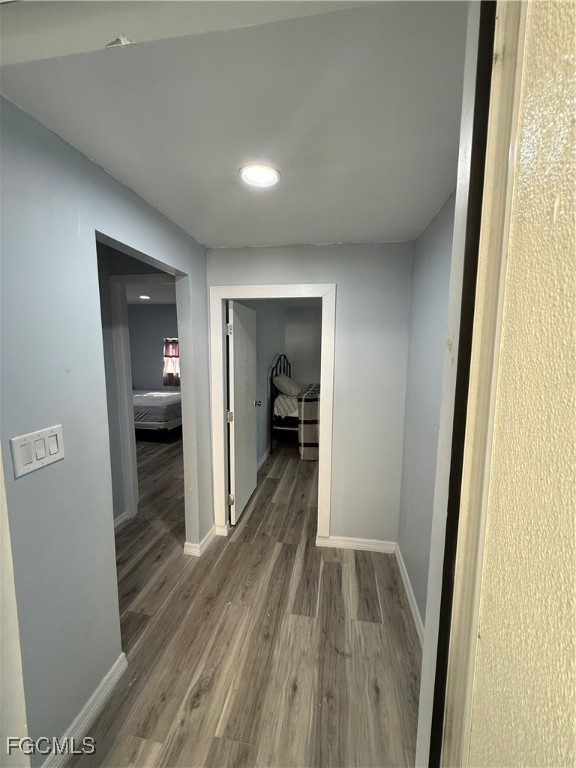 6671 Keystone Court North Port, FL 34287 - Photo 11 of 20 a view of a hallway view with wooden floor and staircase