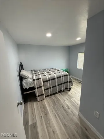 a bedroom with a bed and a dresser