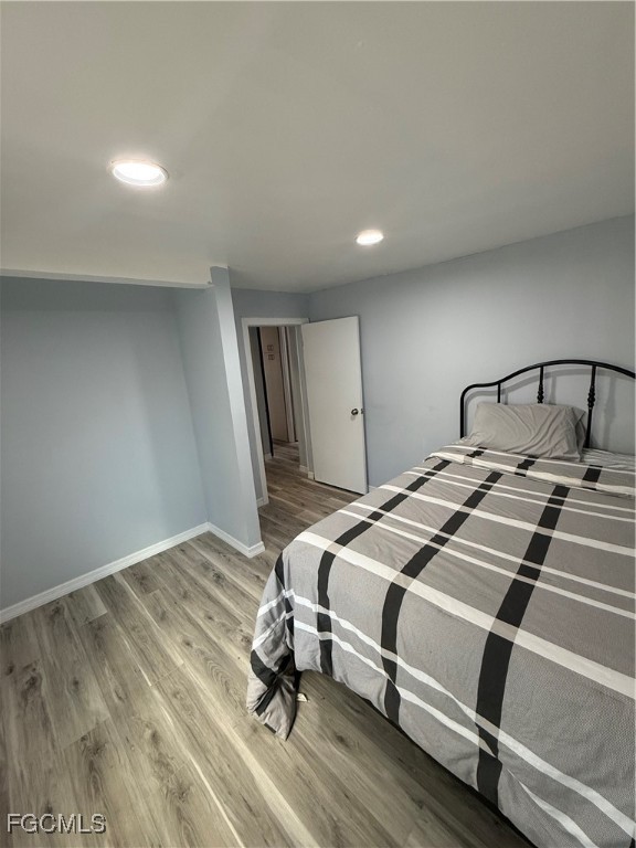 6671 Keystone Court North Port, FL 34287 - Photo 13 of 20 a bedroom with a bed and a dresser