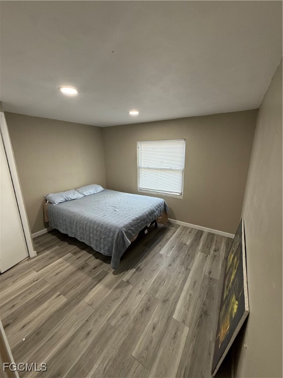 6671 Keystone Court North Port, FL 34287 - Photo 15 of 20 a bedroom with a bed and window