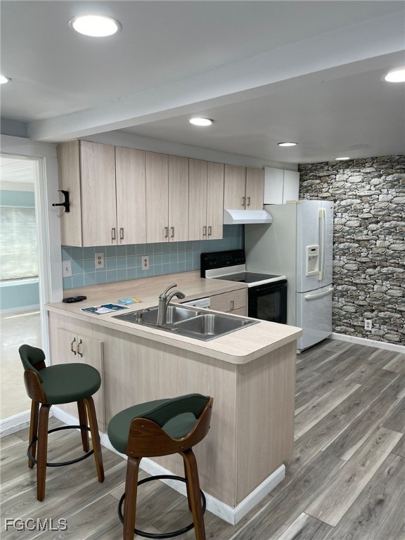 6671 Keystone Court North Port, FL 34287 - Photo 5 of 20 a kitchen with kitchen island a stove a table and chairs in it