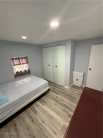 a view of a hallway view with wooden floor and staircase