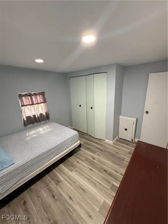 6671 Keystone Court North Port, FL 34287 - Photo 10 of 20 a bedroom with a bed and a large mirror