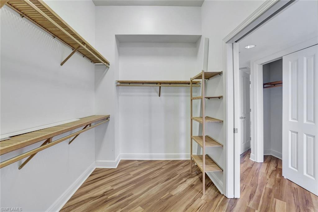 1060 Borghese Lane, Unit 2001 Naples, FL 34114 - Photo 15 of 35 Walk in closet featuring light wood-style floors