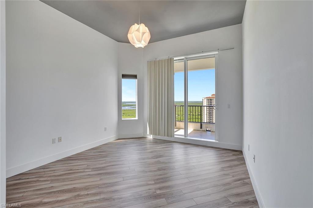 1060 Borghese Lane, Unit 2001 Naples, FL 34114 - Photo 18 of 35 Empty room featuring light wood-type flooring and baseboards