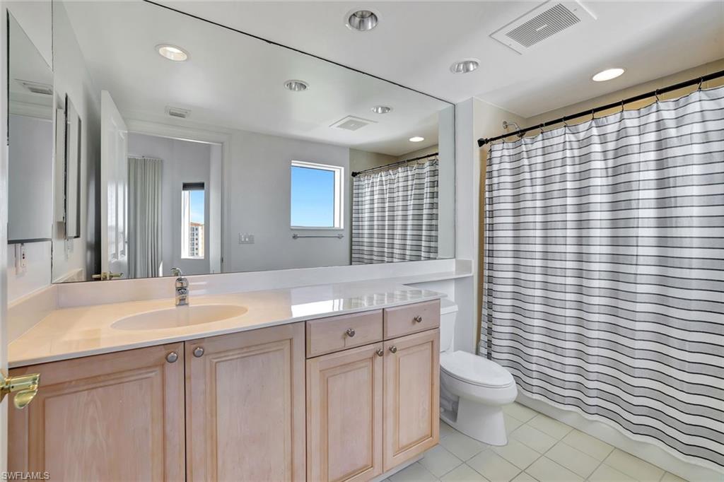 1060 Borghese Lane, Unit 2001 Naples, FL 34114 - Photo 19 of 35 Bathroom featuring vanity, light tile patterned floors, and recessed lighting