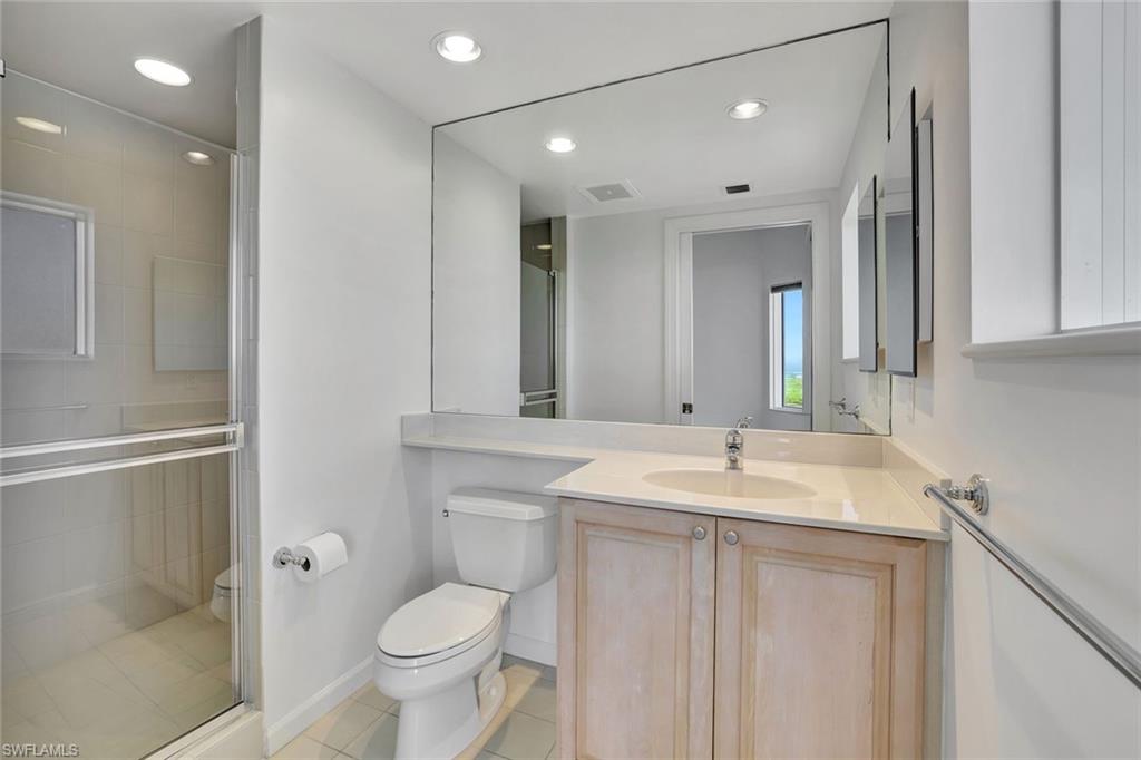 1060 Borghese Lane, Unit 2001 Naples, FL 34114 - Photo 21 of 35 Full bathroom with vanity, a shower stall, recessed lighting, and light tile patterned flooring
