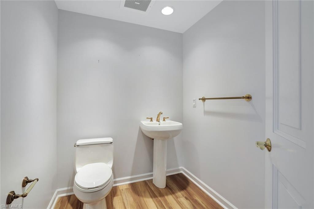 1060 Borghese Lane, Unit 2001 Naples, FL 34114 - Photo 23 of 35 Half bath with light wood-style floors and recessed lighting