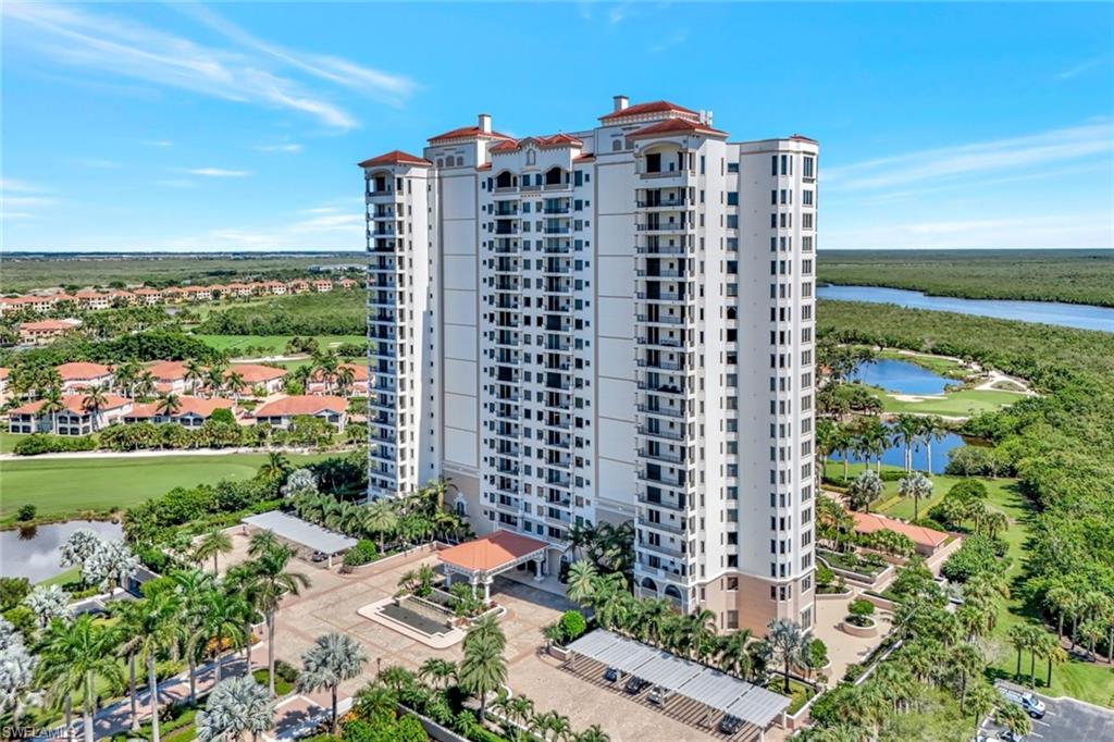 1060 Borghese Lane, Unit 2001 Naples, FL 34114 - Photo 32 of 35 View of apartment building / complex featuring a water view and golf course view