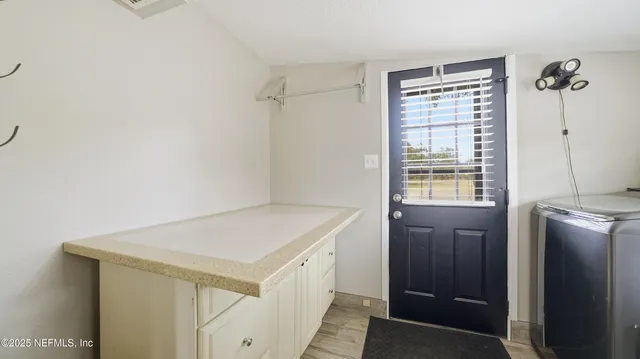 a front view of house with a garden