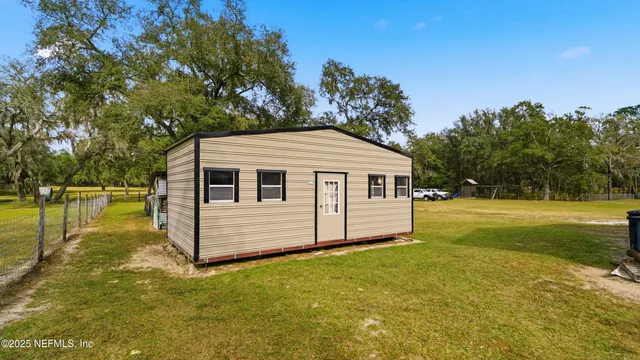 a view of a house with a big yard