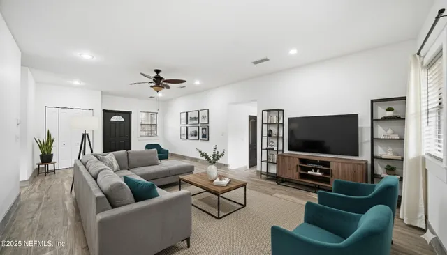 a living room with furniture and a flat screen tv