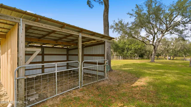 a swimming pool with an outdoor space and seating area