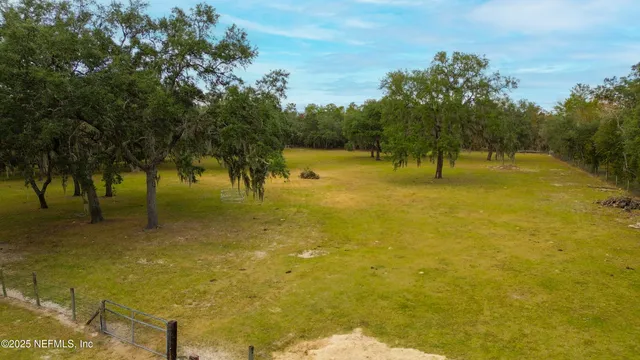 an aerial view of a house with a swimming pool