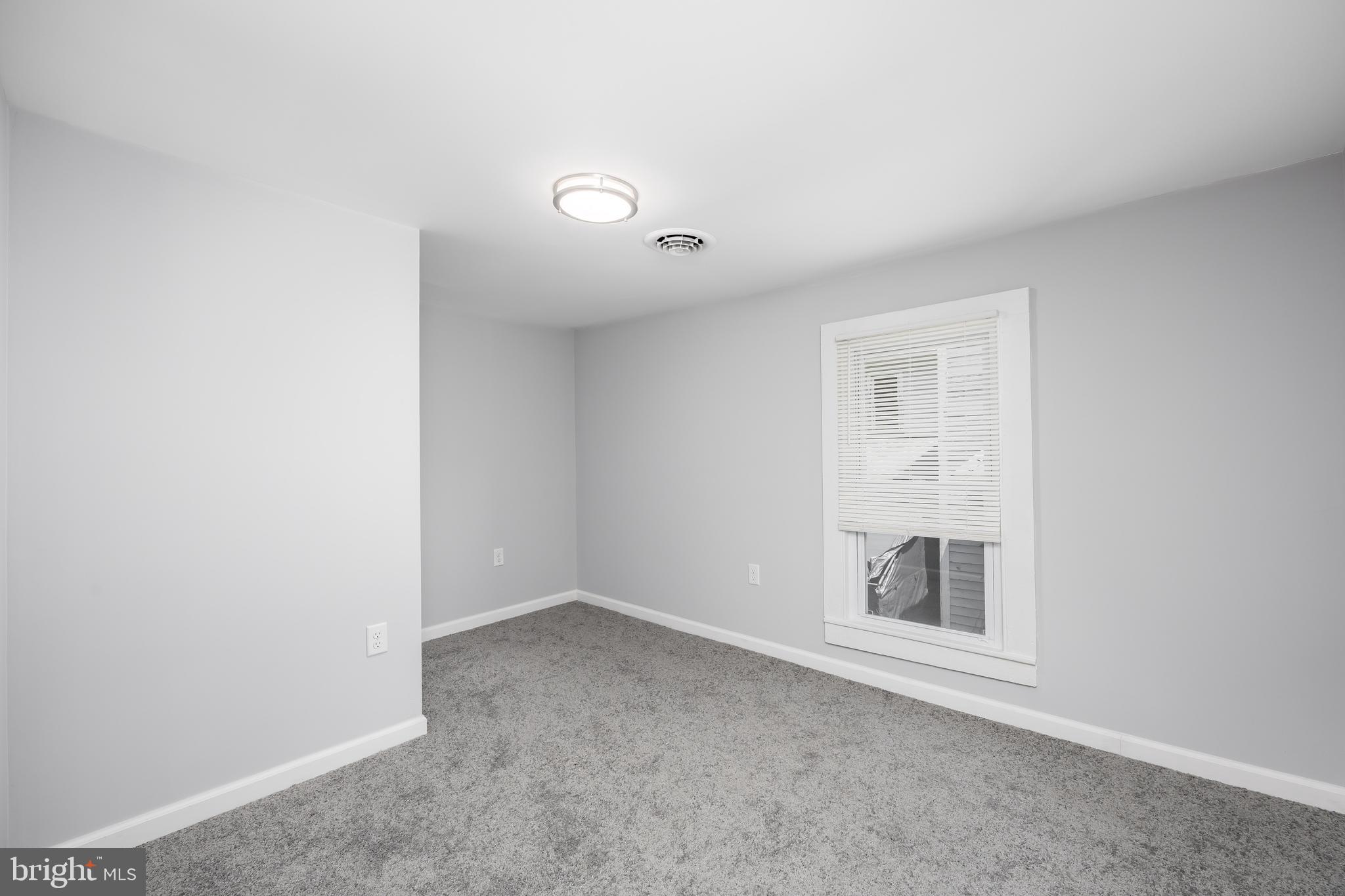 8359 Newark Road Newark, MD 21841 - Photo 38 of 53 an empty room with a empty space and window