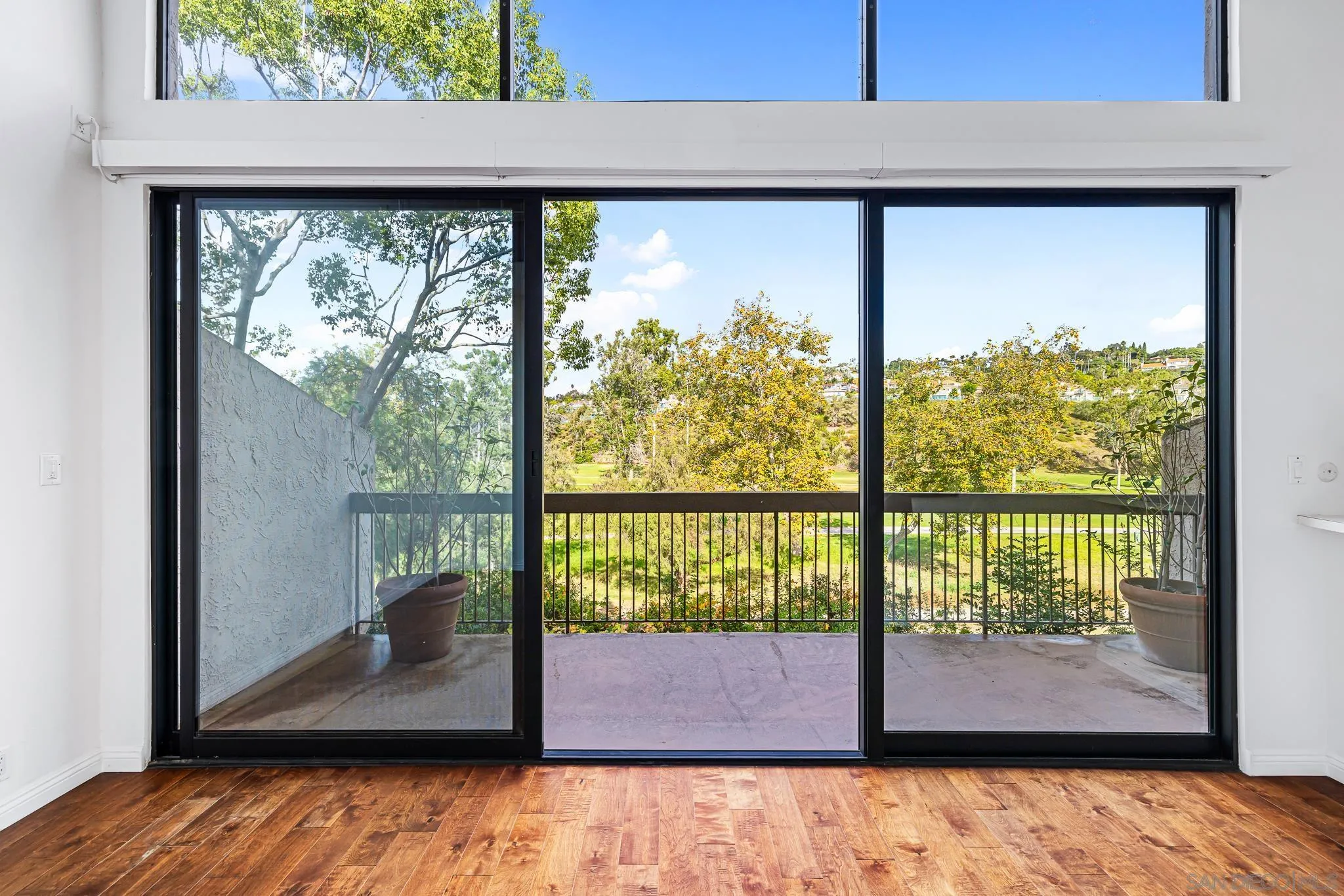 2564 Navarra Drive, Unit 108 Carlsbad, CA 92009 - Photo 1 of 23 a view of a floor to ceiling window and a floor to ceiling window