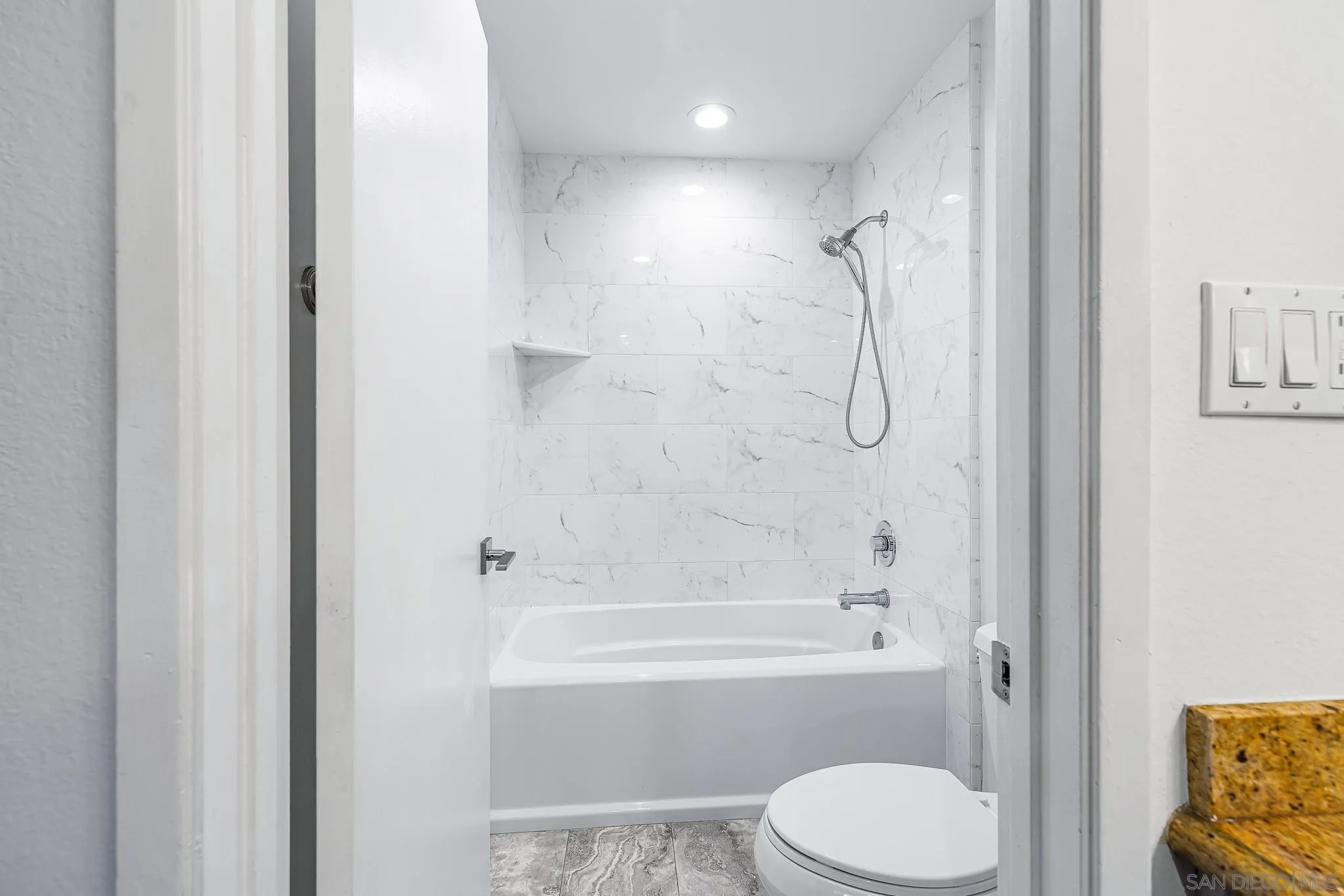 2564 Navarra Drive, Unit 108 Carlsbad, CA 92009 - Photo 12 of 23 a bathroom with a toilet and shower