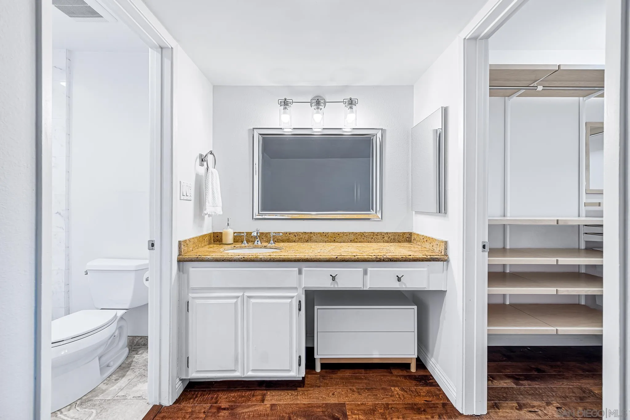 2564 Navarra Drive, Unit 108 Carlsbad, CA 92009 - Photo 14 of 23 a bathroom with a sink and a mirror