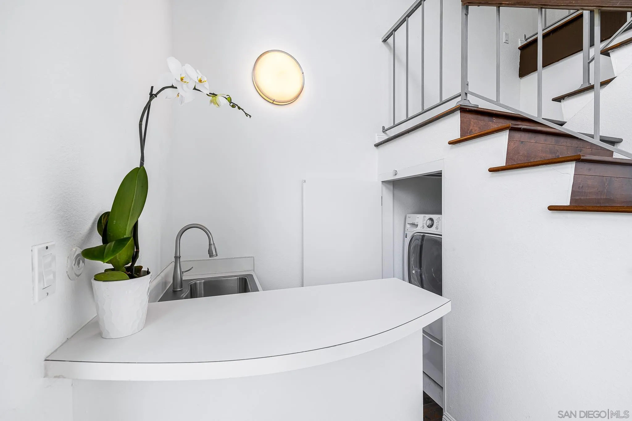 2564 Navarra Drive, Unit 108 Carlsbad, CA 92009 - Photo 17 of 23 a close view of a sink a faucet and a chandelier