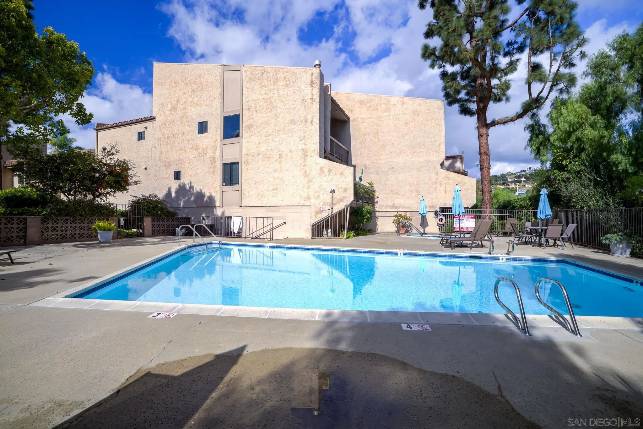 2564 Navarra Drive, Unit 108 Carlsbad, CA 92009 - Photo 23 of 23 a view of swimming pool with outdoor seating and plants