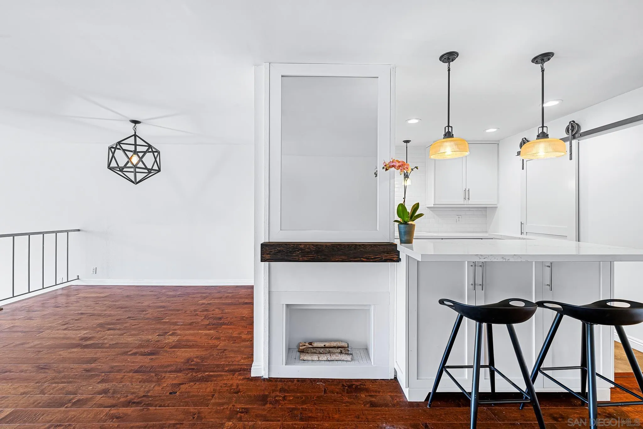 2564 Navarra Drive, Unit 108 Carlsbad, CA 92009 - Photo 6 of 23 a living room with furniture and a fireplace