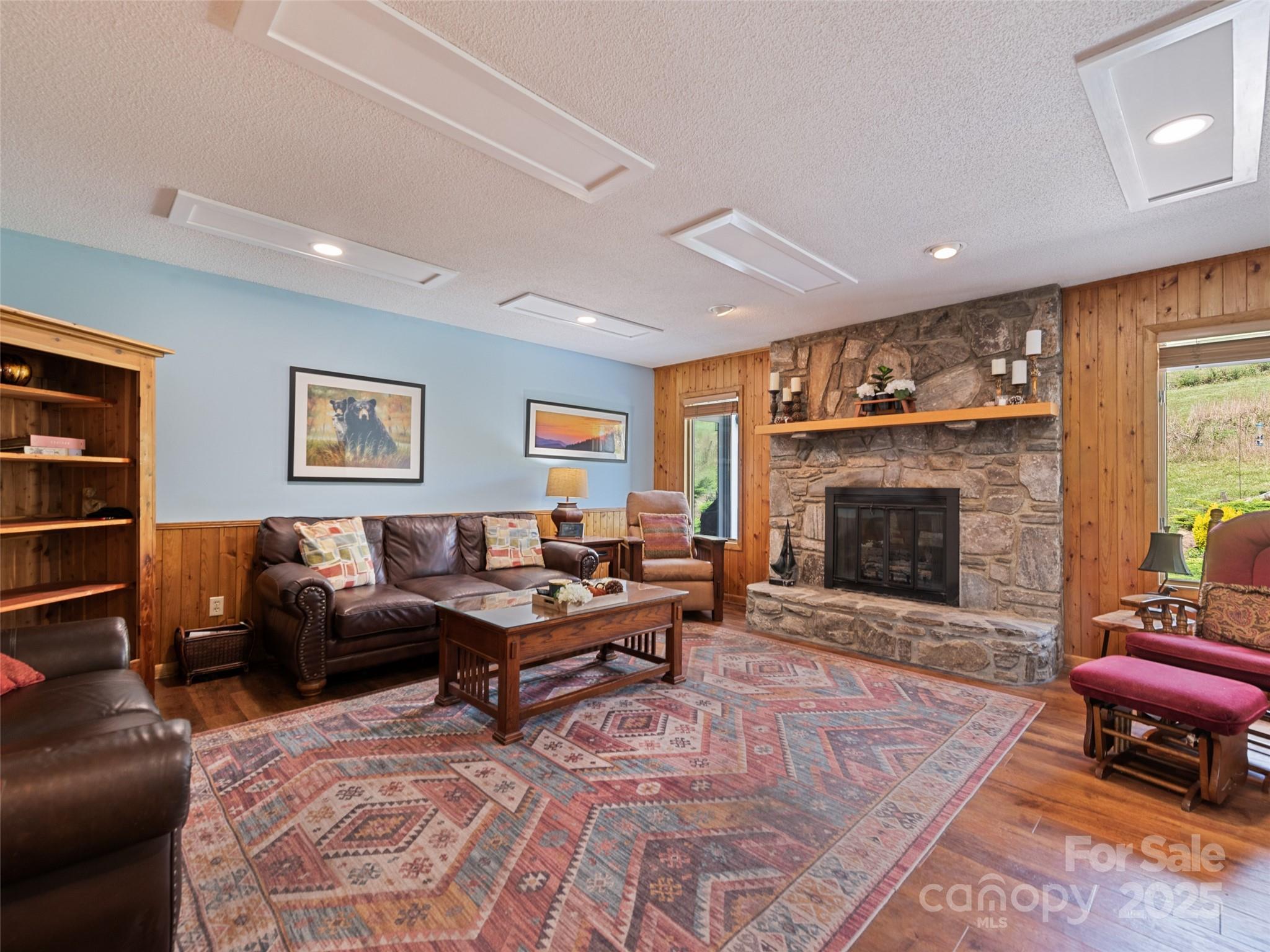 3735 Iron Duff Road Waynesville, NC 28785 - Photo 12 of 48 a living room with furniture and a fireplace