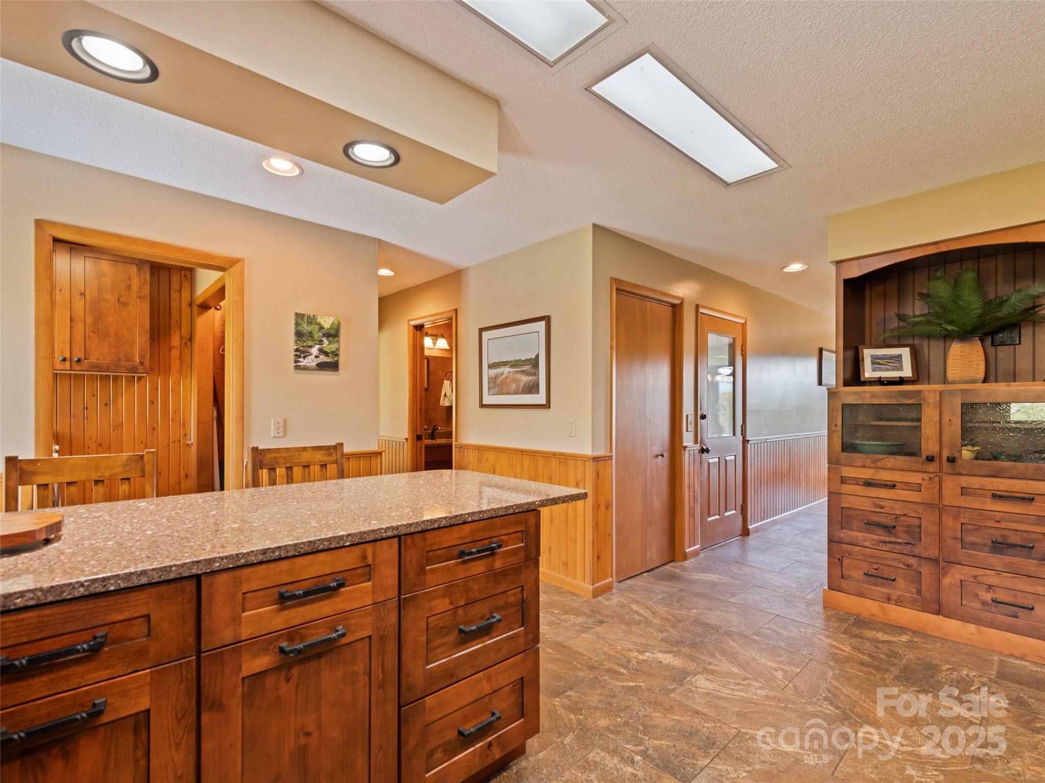 3735 Iron Duff Road Waynesville, NC 28785 - Photo 20 of 48 a spacious bathroom with a granite countertop sink and a mirror