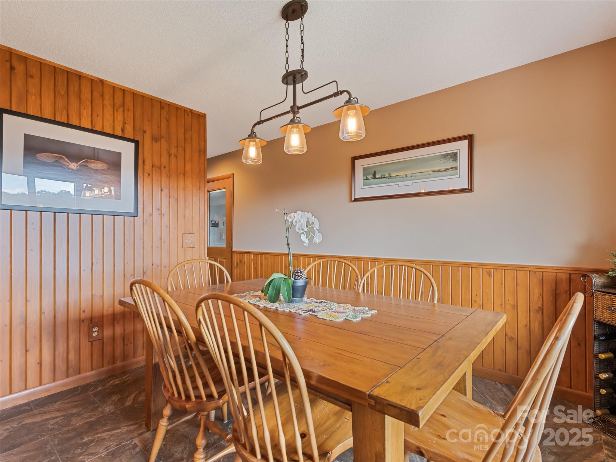 3735 Iron Duff Road Waynesville, NC 28785 - Photo 26 of 48 a view of a dining room with furniture and wooden floor