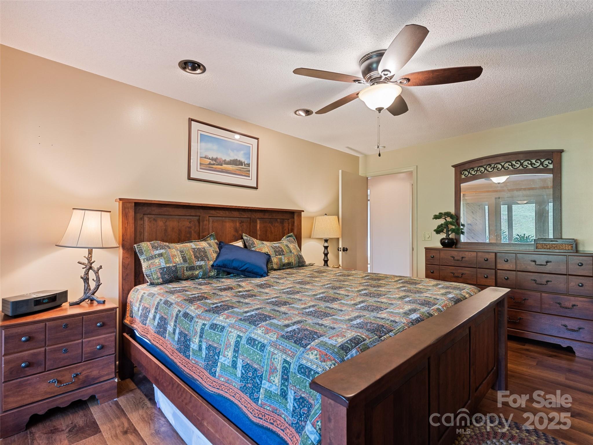 3735 Iron Duff Road Waynesville, NC 28785 - Photo 34 of 48 a bedroom with a bed and a dresser