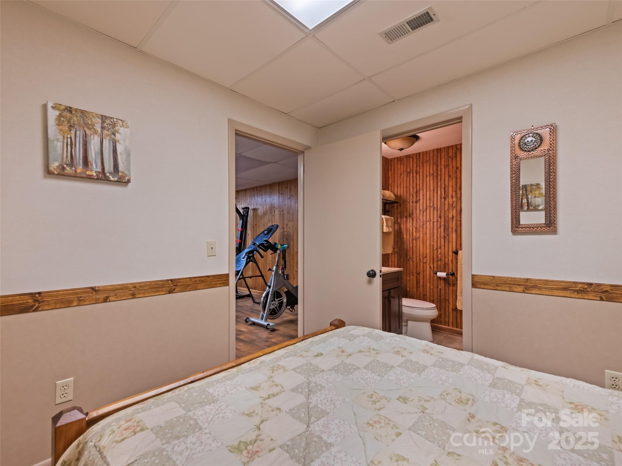 3735 Iron Duff Road Waynesville, NC 28785 - Photo 40 of 48 a bedroom with bed and wooden floor