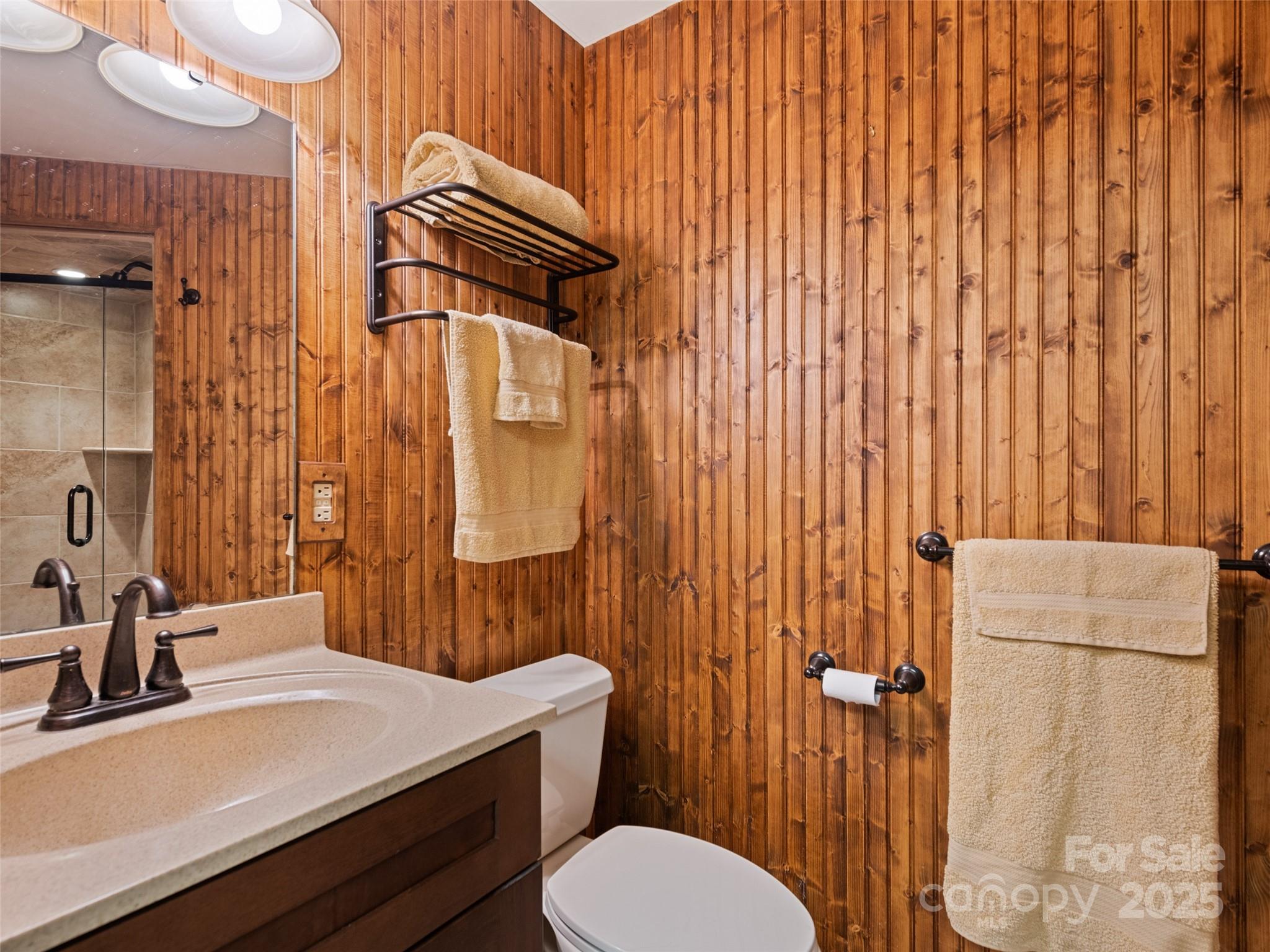 3735 Iron Duff Road Waynesville, NC 28785 - Photo 41 of 48 a bathroom with a sink a toilet and shower